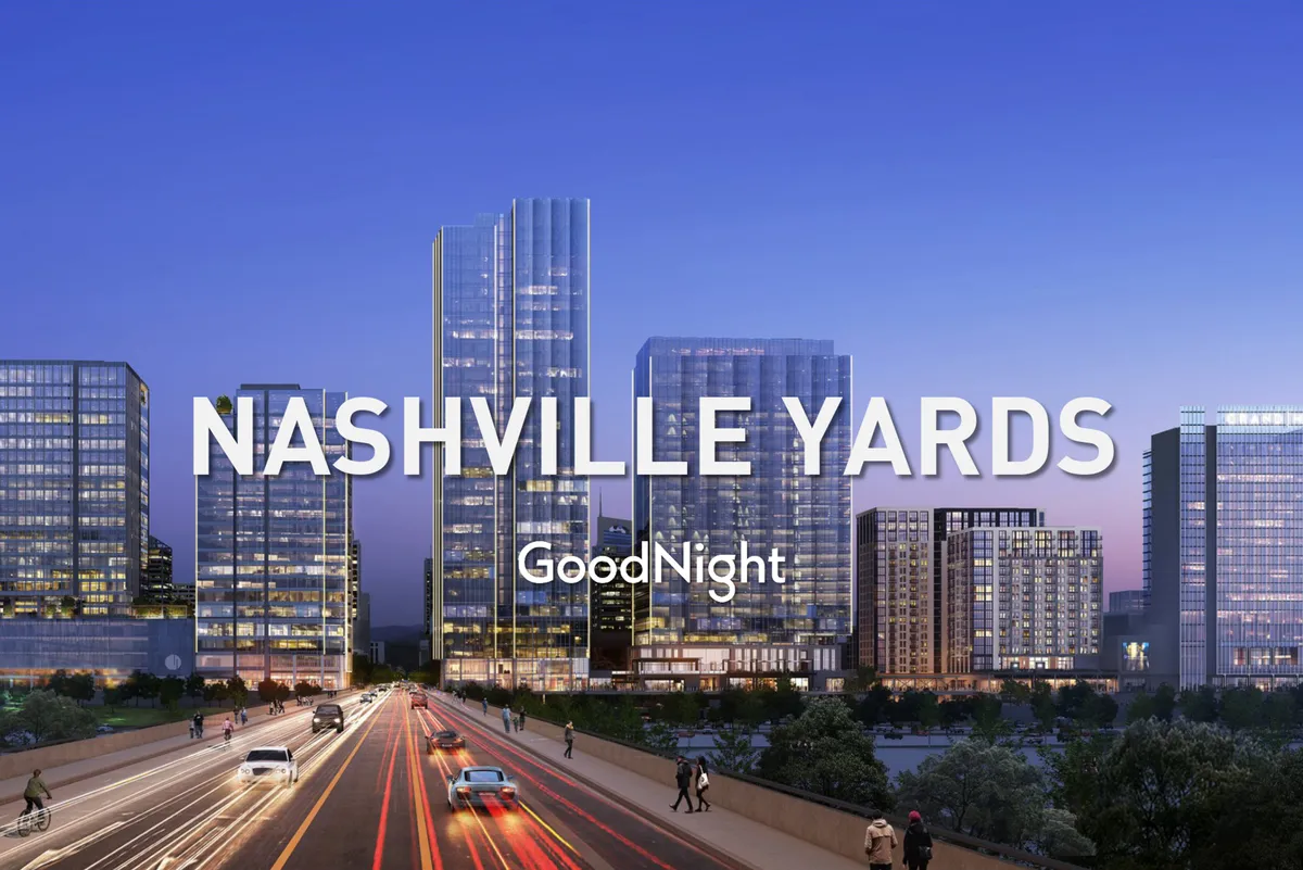 A striking exterior view of Nashville's city skyline, complete with skyscrapers, illuminated city streets, and an urban landscape. The mood is dynamic and inviting, suggesting the kind of impressive city views available from a rooftop vantage point, especially at sunset.